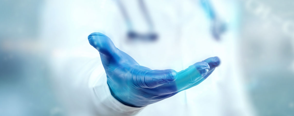 A doctor reaching out their hand
